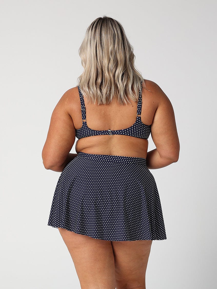 model showing back of navy dots skater skirt