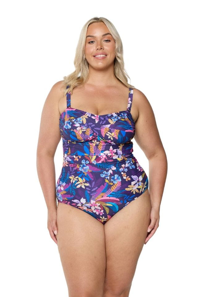 model wearing navy floral bandeau swimsuit with straps