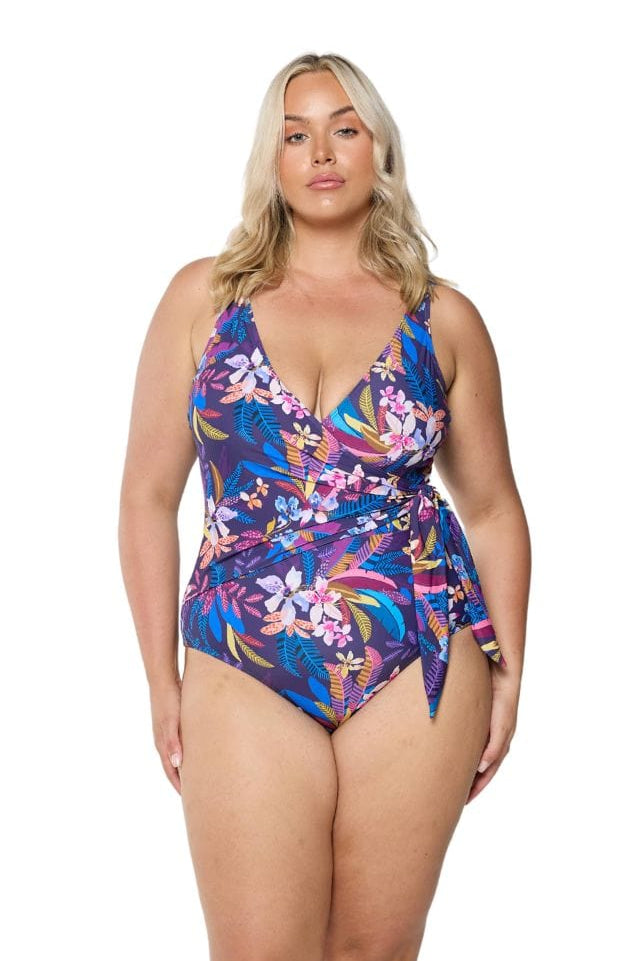 model wearing navy floral waist tie one piece