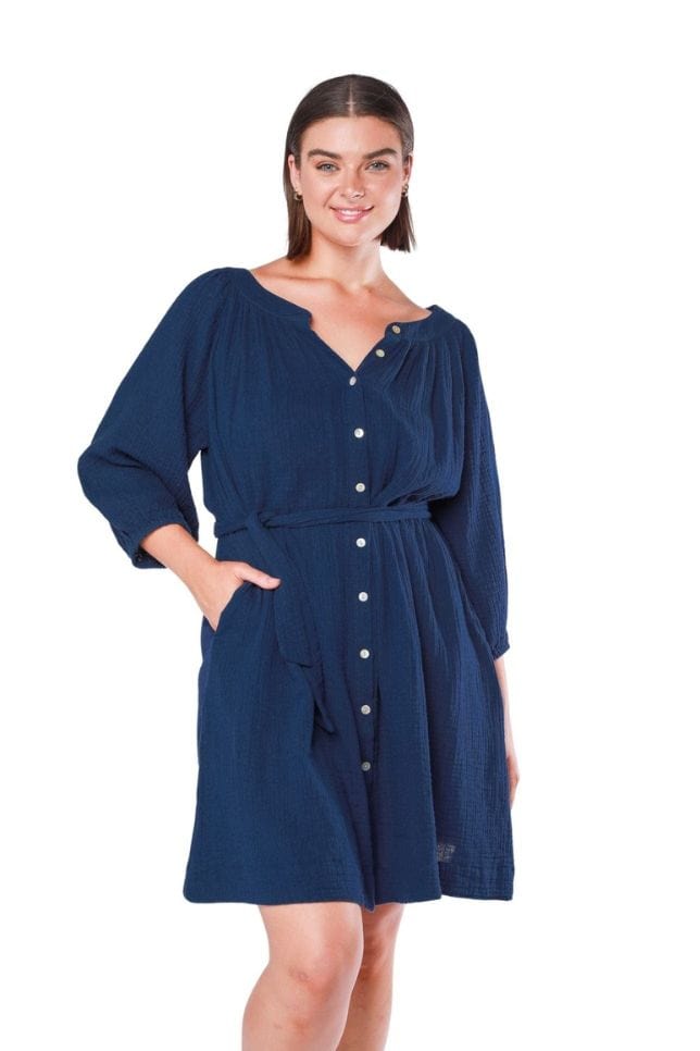 model wearing navy cheesecloth beach dress with hand in pocket