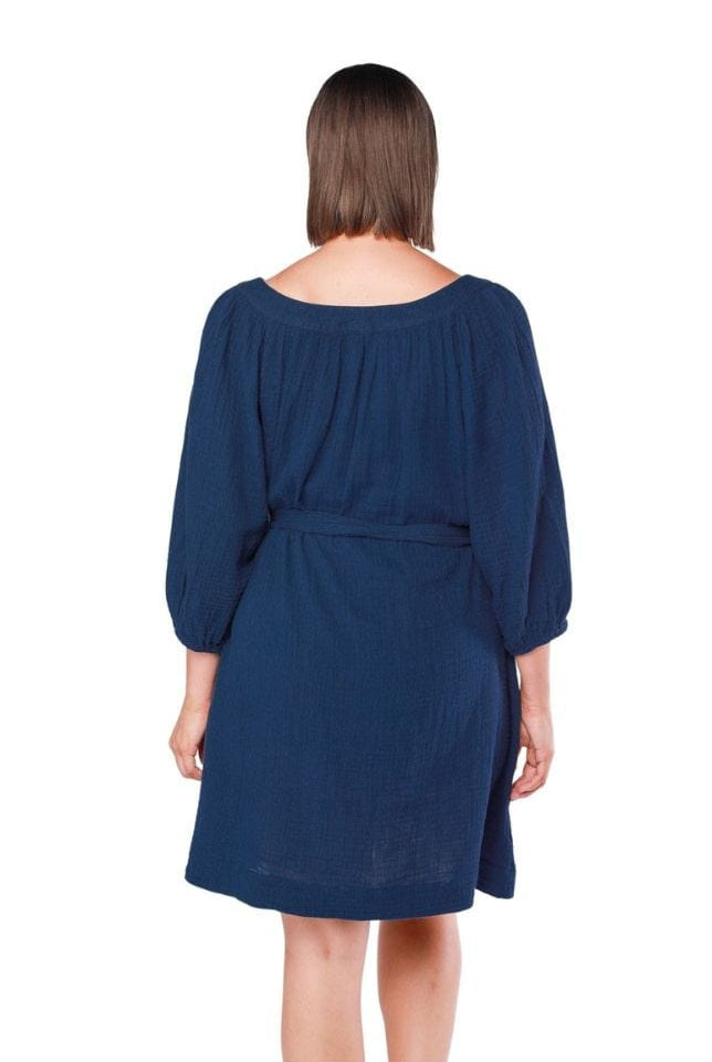 back of model wearing navy cheesecloth dress with waist tie