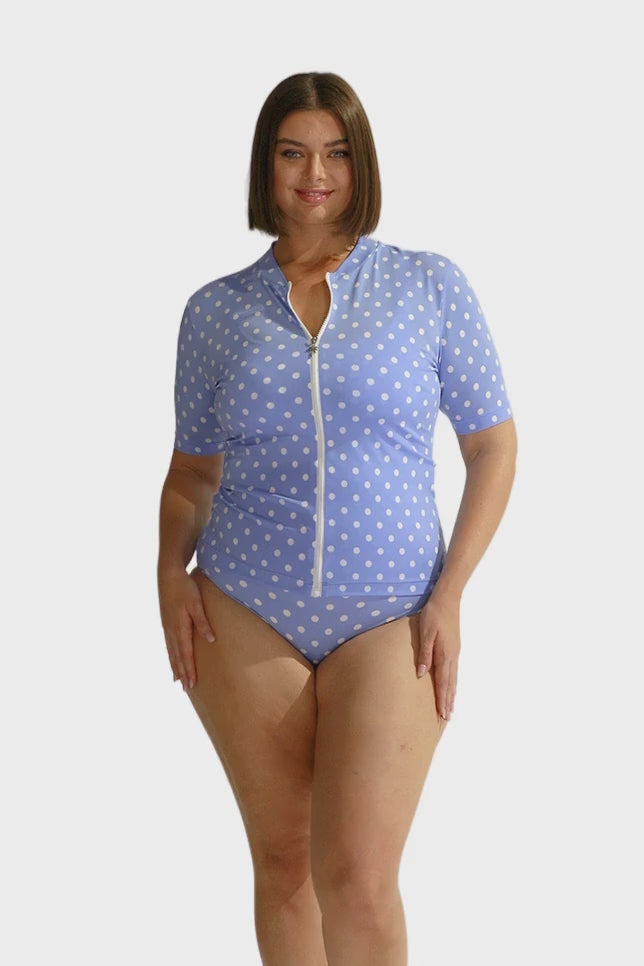 Model wearing Womens Blue Polkadot Chlorine Resistant Short Sleeve Rash Vest with Full Zip