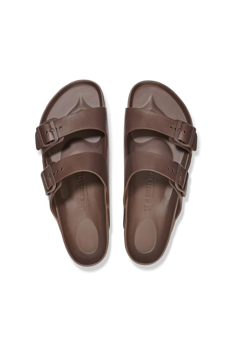 Pair of brown sandals on a white background