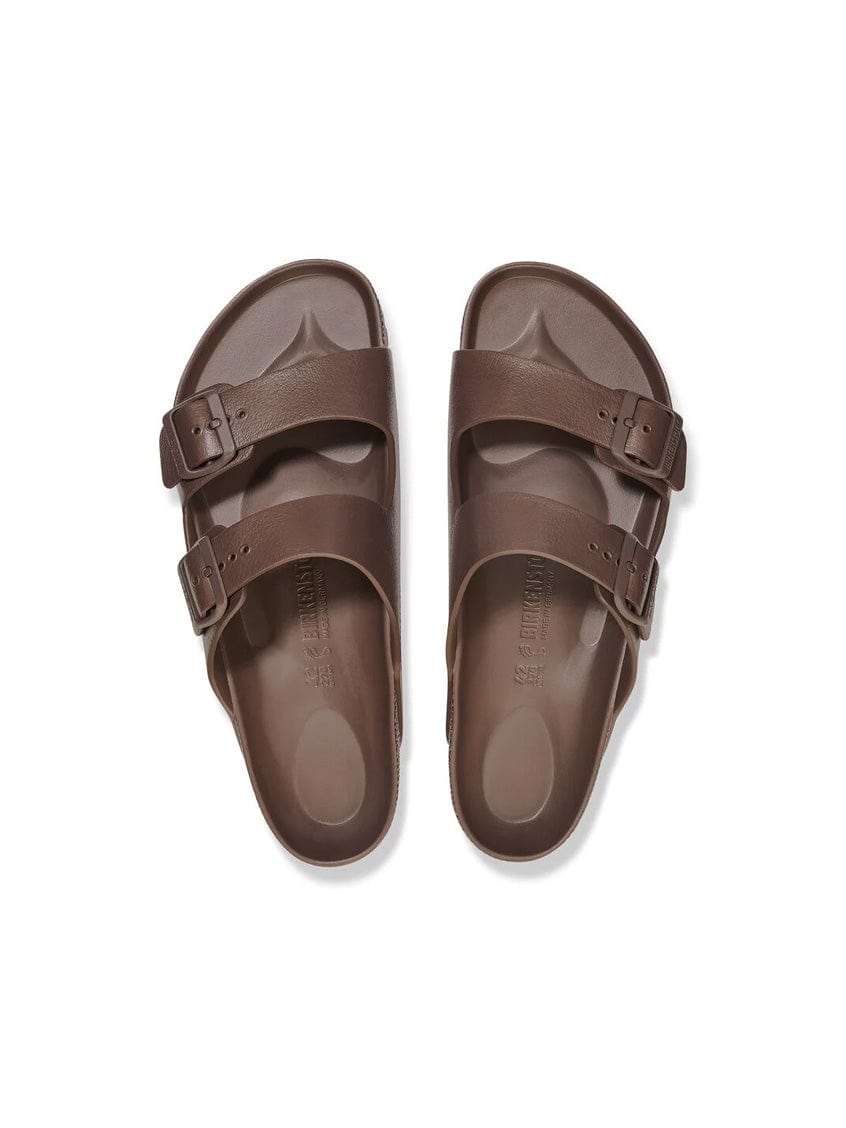 Pair of brown sandals on a white background