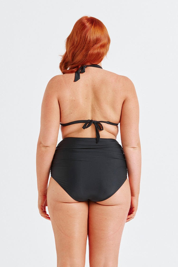 model showing back of black ruched swim pant