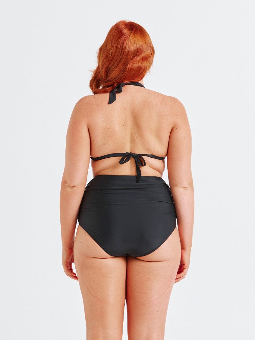 model showing back of black ruched swim pant