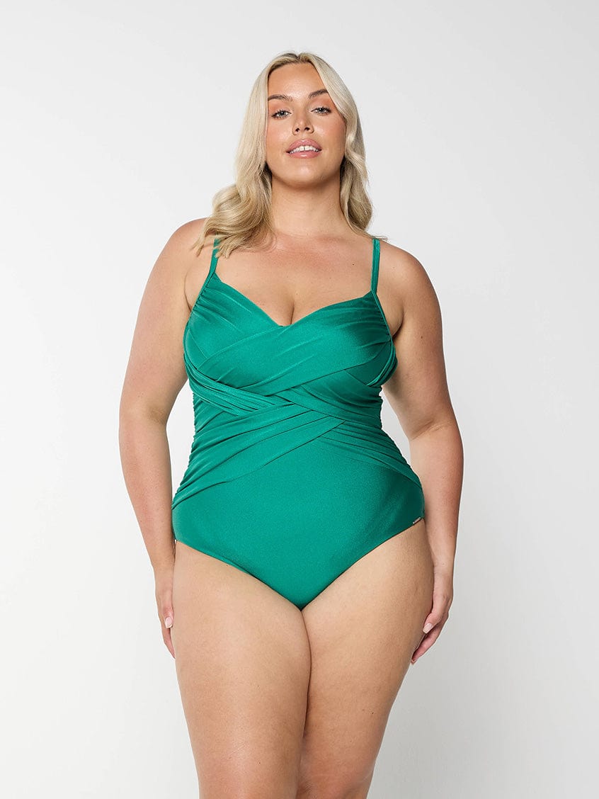 model wearing metallic emerald women's one piece