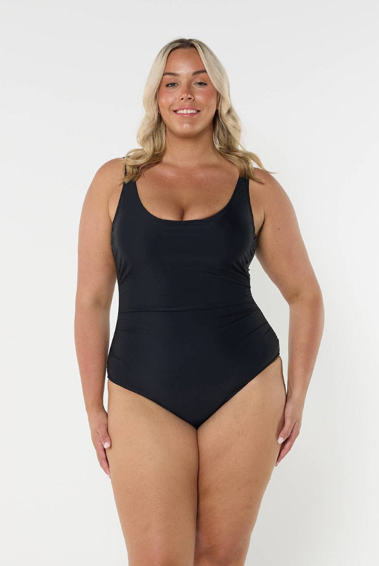 model wearing black scooped one piece