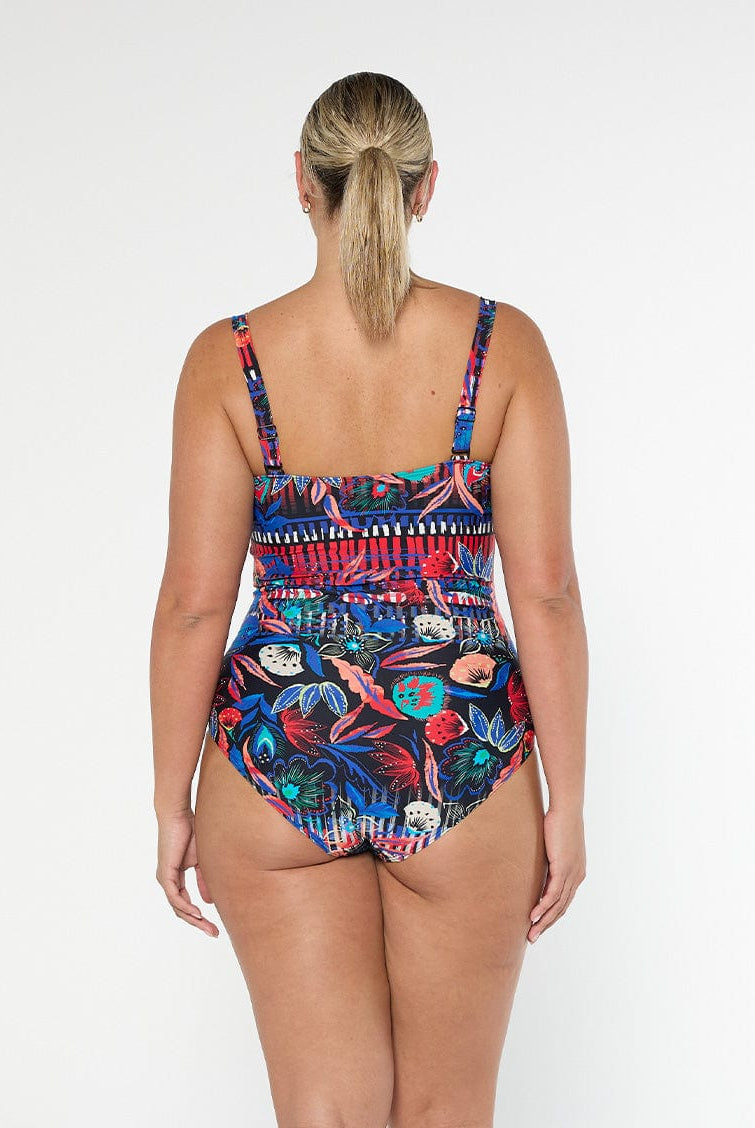 model showing back of bright patterned swimsuit