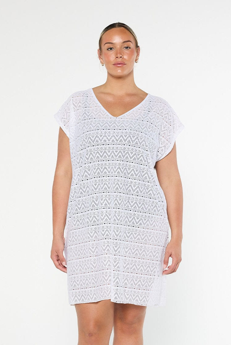 model wearing white mesh beach cover up
