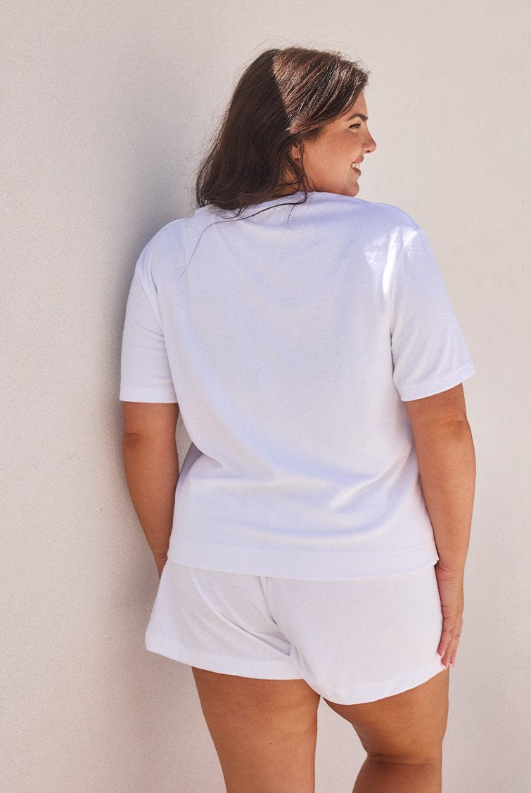 model showing back of white terry towelling shirt
