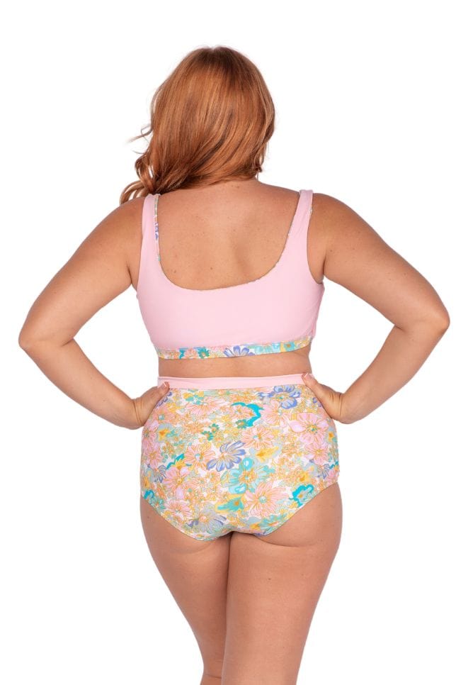Back of model wearing pastel coloured high waisted swim pants