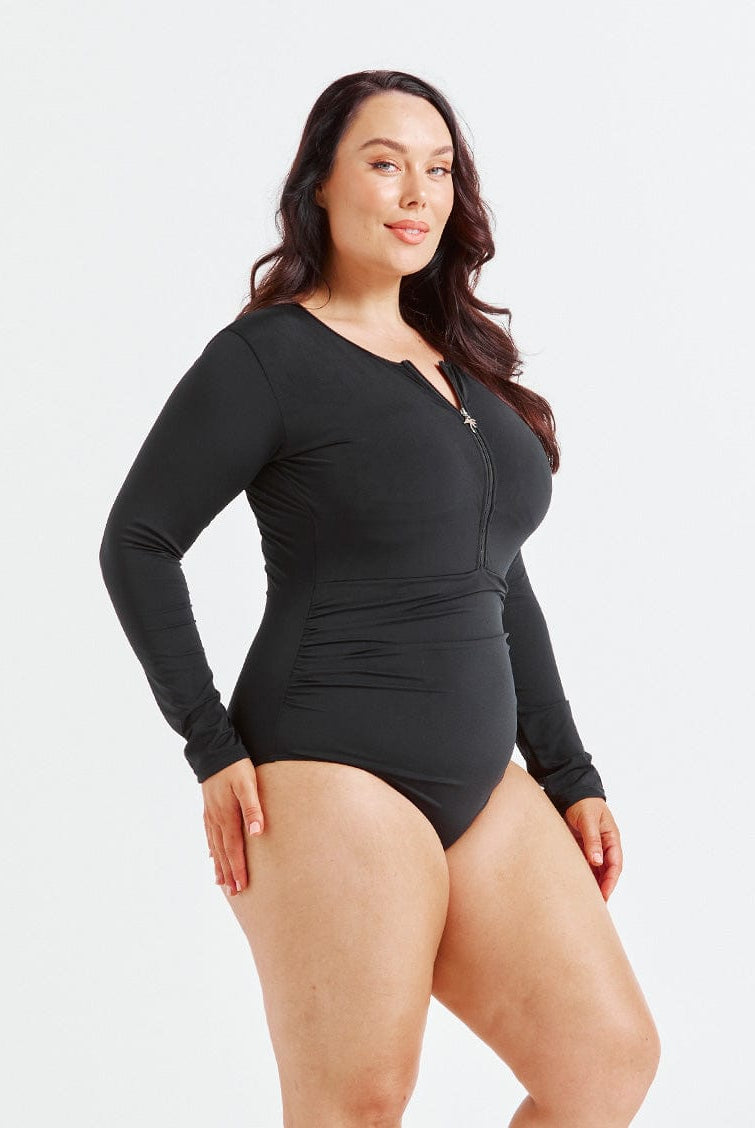 model showing side of black long sleeve one piece swimsuit