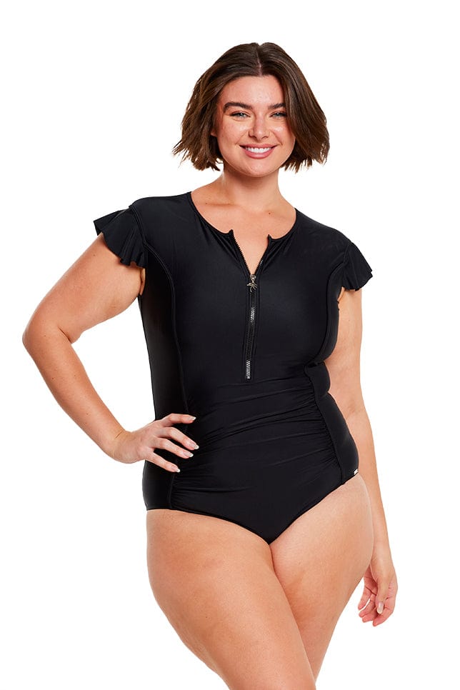 Brunette model wearing black frill sleeve zip front one piece swimsuit