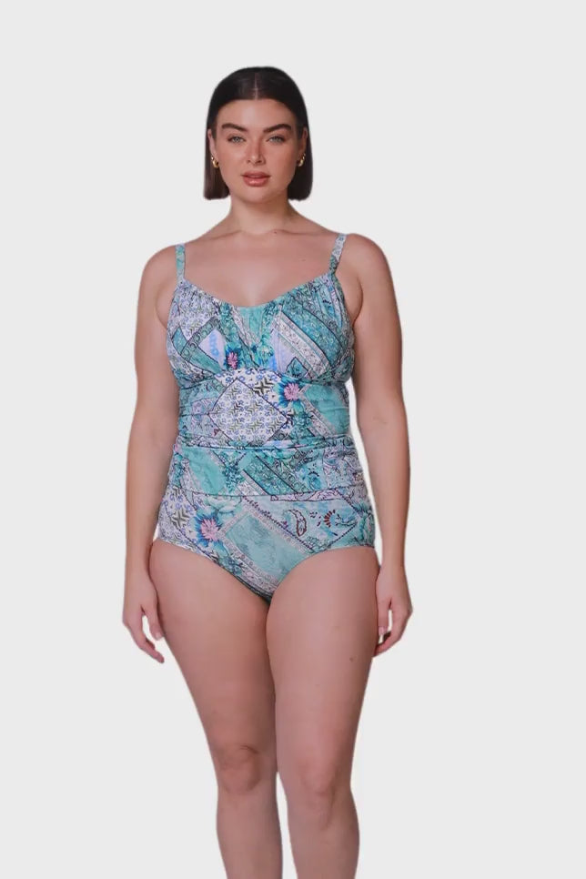 brunette women wearing aqua blue patchwork underwire tankini swim top