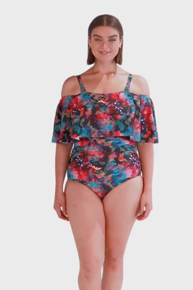 Product video of brunette women modelling an off the shoulder one piece swimsuit