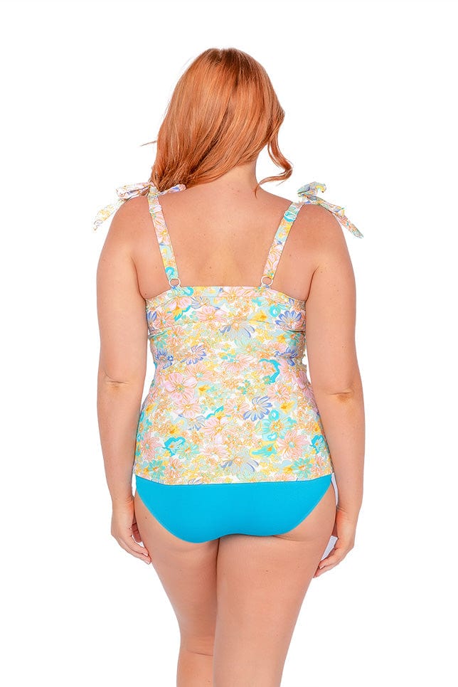 women wearing floral underwire tankini top in retro floral print. Tankini top has adjustable straps and bows that can be removable