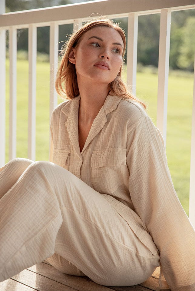 Model wearing cream Long Button Up Pyjamas