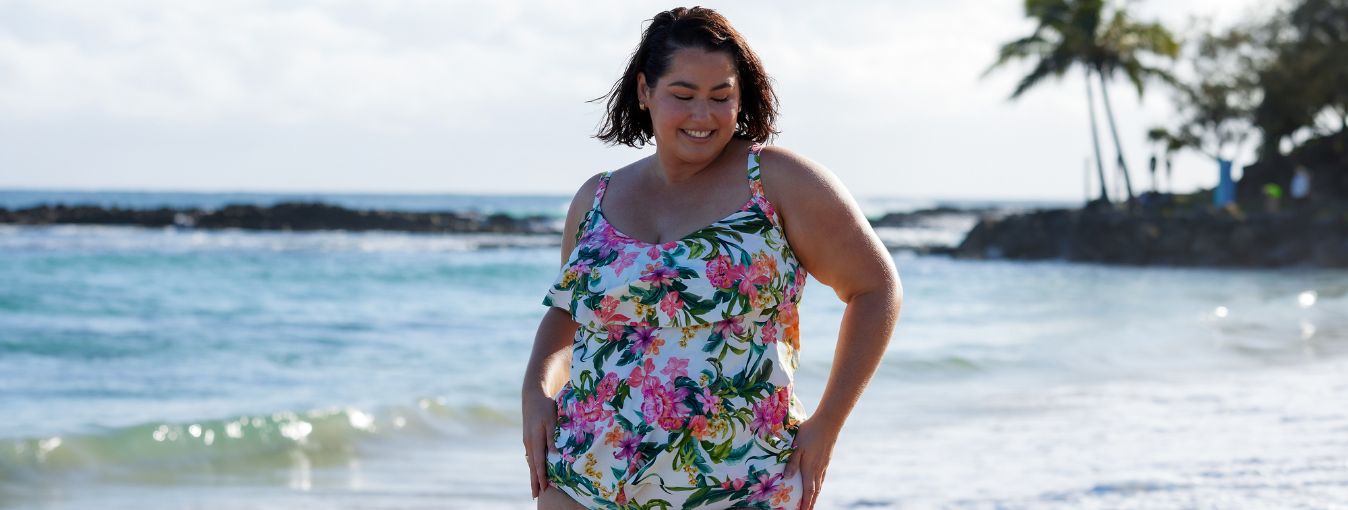 woman with short brown hair wears white floral 3 tier ruffle maternity tankini top 