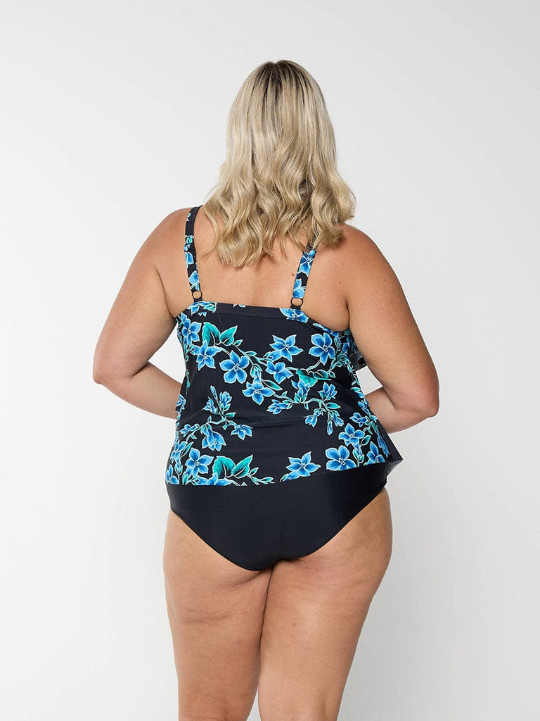 Model showing the back of a blue floral tankini top with adjustable straps