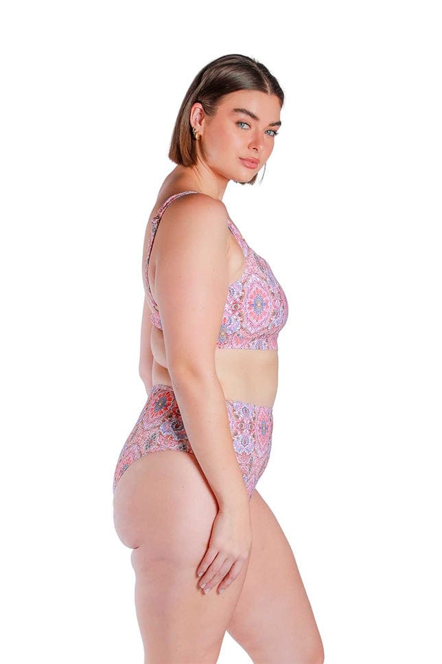 Model wearing pink printed square neck bikini top