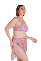 Model wearing pink printed long tie side mesh swimming skirt