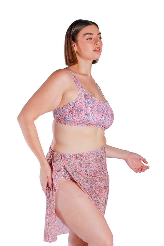 Model wearing pink printed long tie side mesh swimming skirt