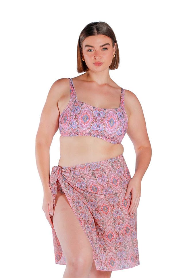 Model wearing pink printed long tie side mesh swimming skirt