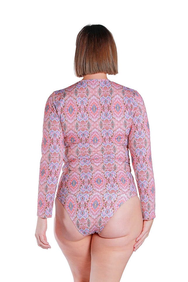 Back Shot of model wearing the pink printed long sleeved rash vest 