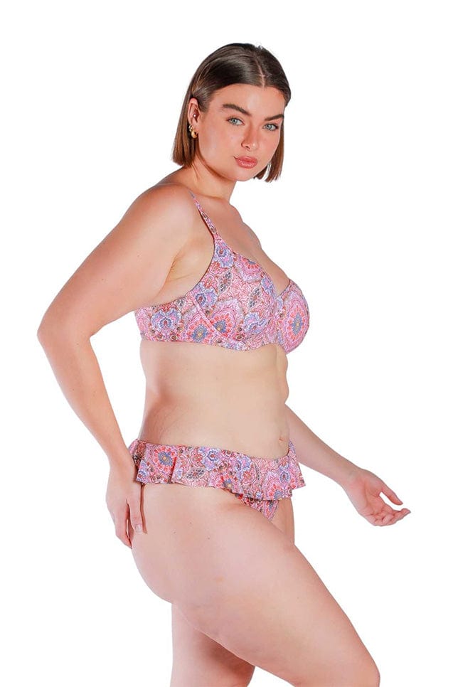 Model wearing pink and red toned frill top bikini pants