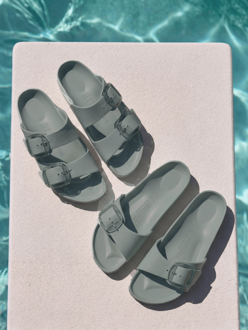 Birkenstock sandals by pool with big buckle detail