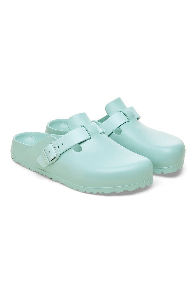 Slip on covered toe clogs for women in green with buckle detail