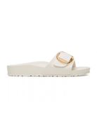 An off-white slide sandal with a wide strap featuring a gold-tone buckle closure, shown from a side profile on a white background.