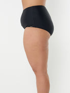 model showing side of black high waisted bikini bottom