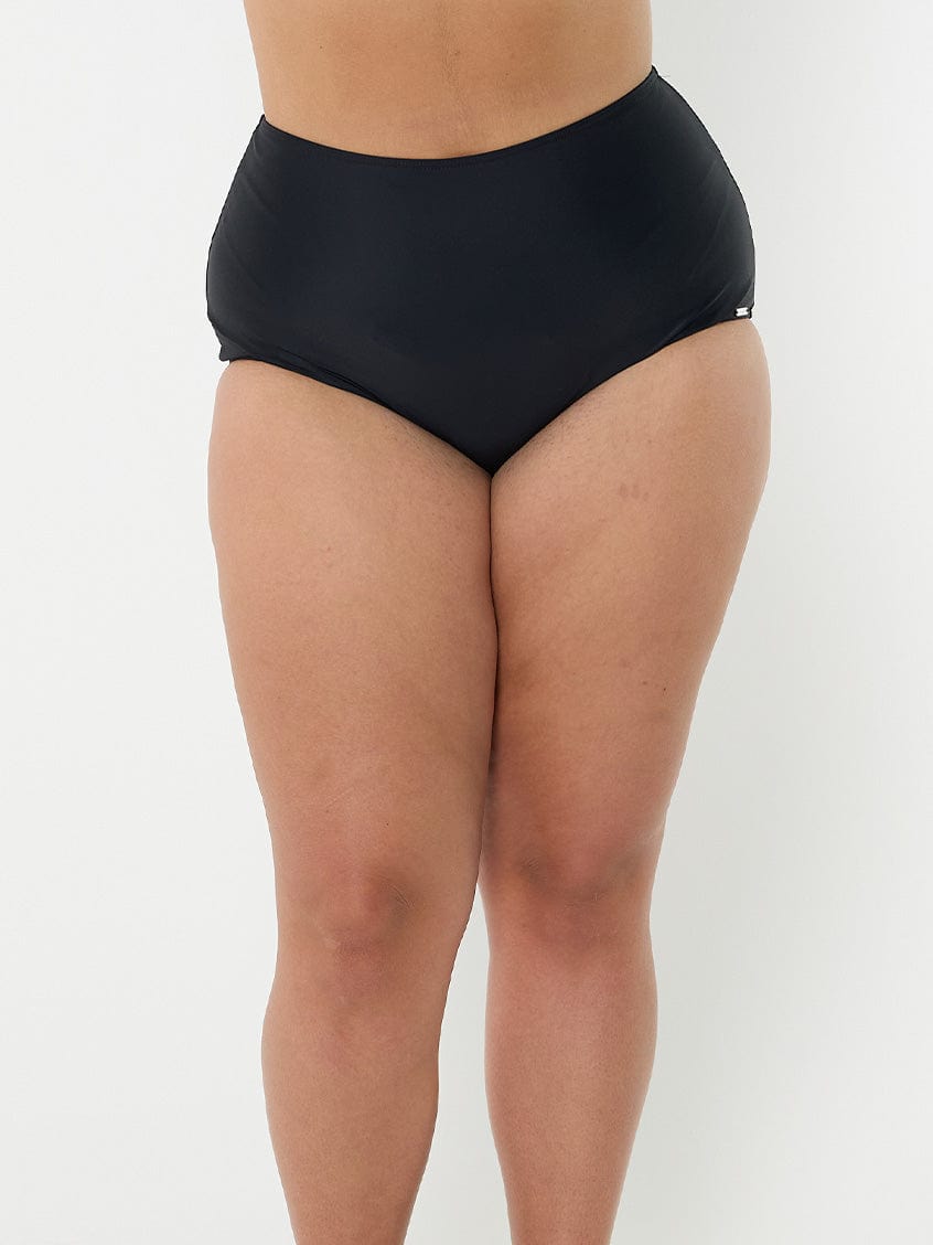 model wearing black high waisted bikini bottom