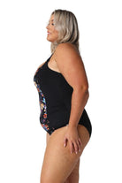 Model showing side of black floral one piece