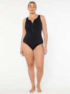 Person wearing a black swimsuit on a white background