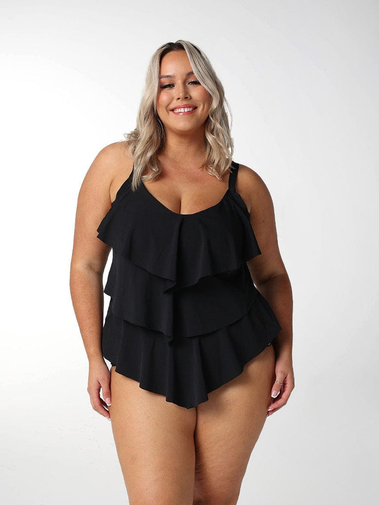 Blonde model wears black chlorine resistant tankini top
