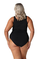 Model showing back of black floral womens swimsuit