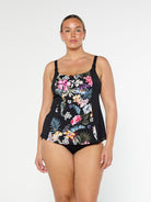 Blonde model shows the front of chlorine resistant floral tankini top with shelf bra and adjustable straps