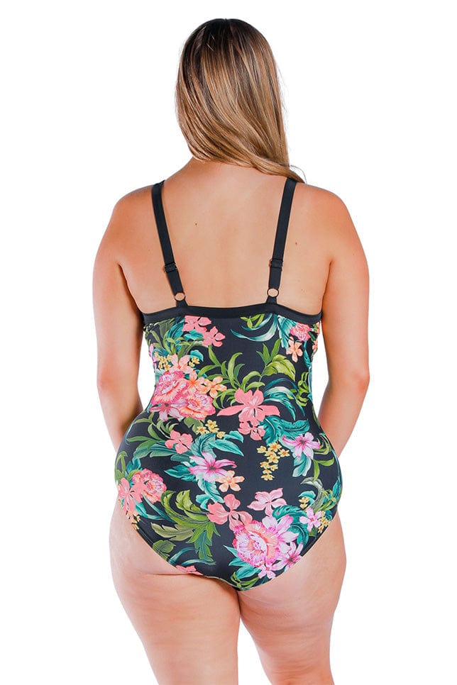 back of model wearing black floral one piece bathing suit