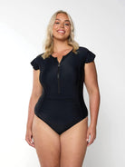 Model wearing black frill sleeve one piece