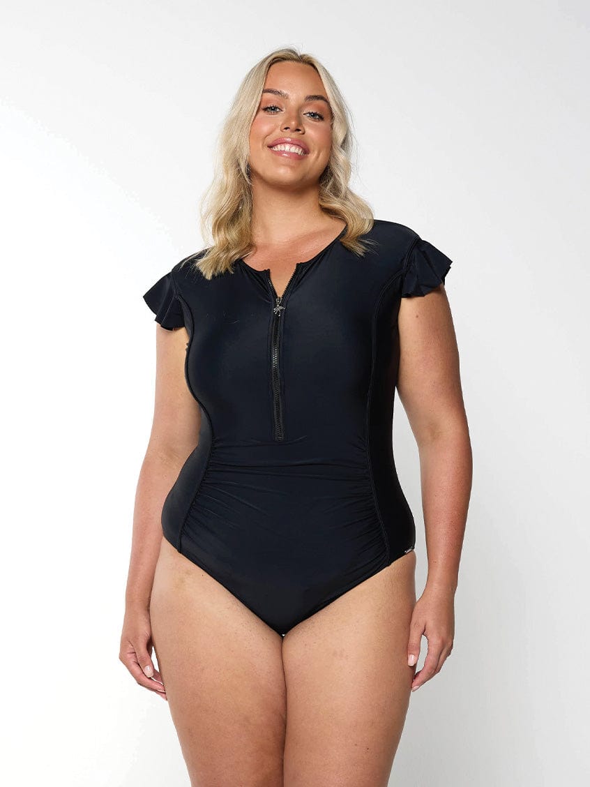 Model wearing black frill sleeve one piece