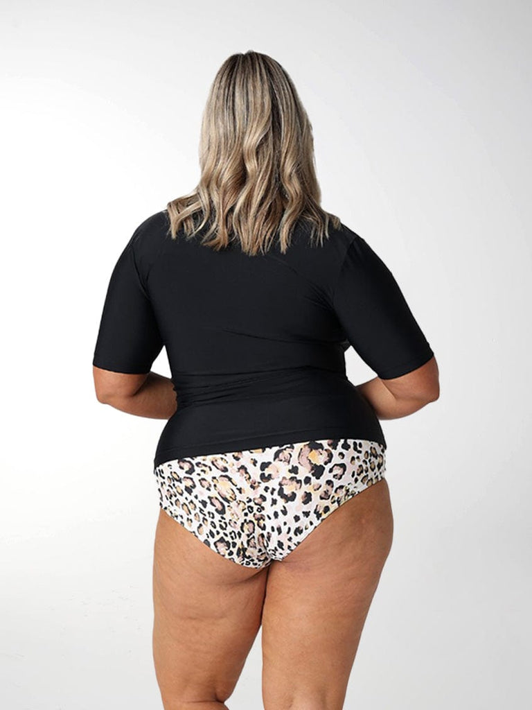 Blonde model showing back of black short sleeve rash vest
