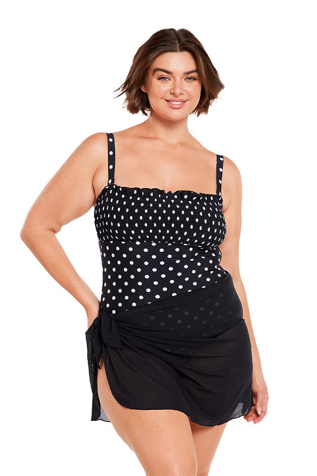 Brunette plus size model wears lightweight mesh short sarong skirt