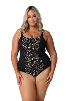 Model wearing black floral chlorine resistant one piece