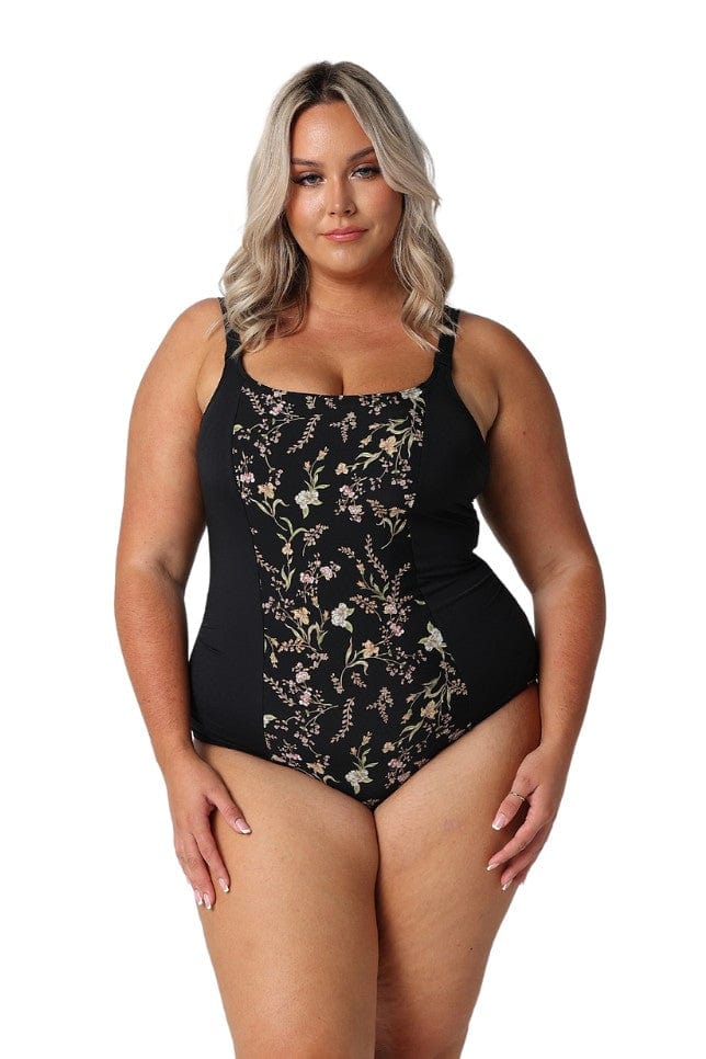 Model wearing black floral chlorine resistant one piece