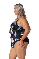 Model showing side of black floral ruffle tankini