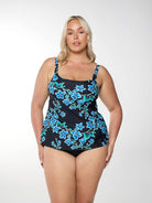 Model shows a blue floral tankini top with scoop neckline and supportive shelf bra