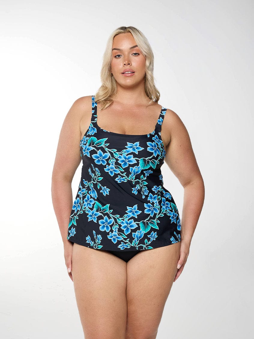 Model shows a blue floral tankini top with scoop neckline and supportive shelf bra